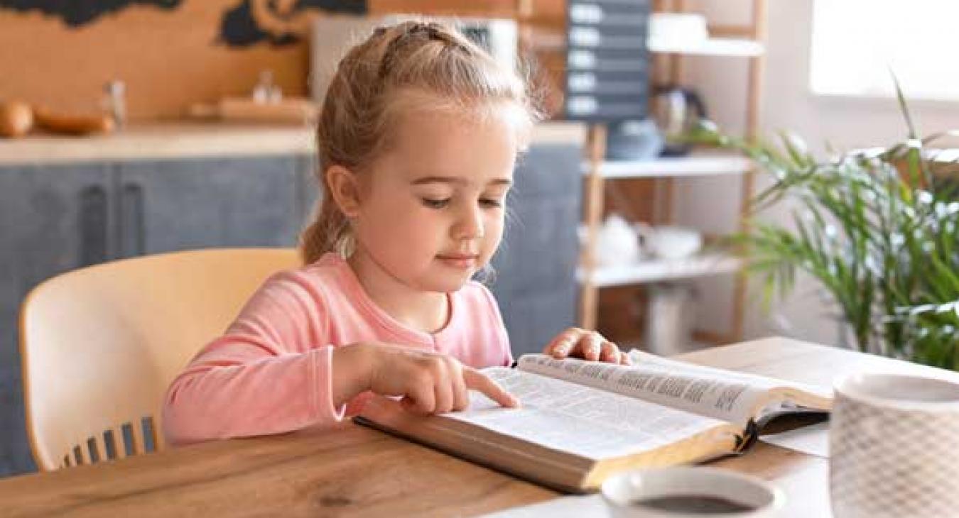 child reading bible