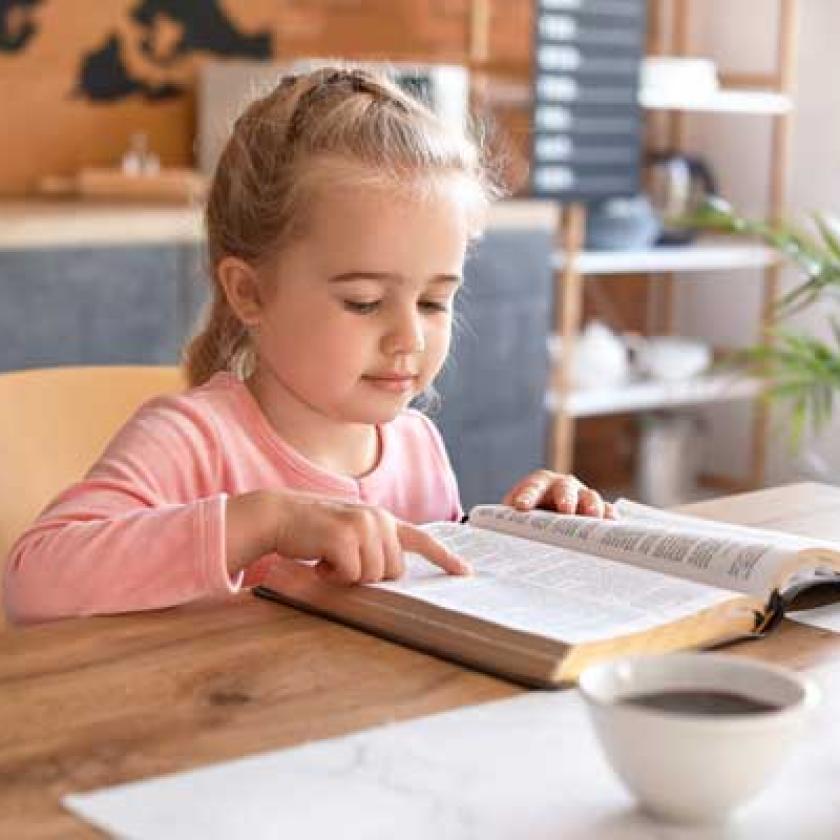 child reading bible